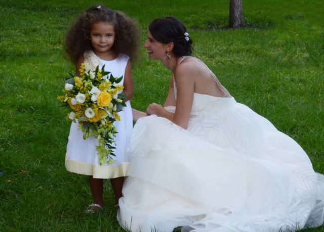 This little flower girl is a scene stealer, but she can't outshine beautiful bride Sara on her wedding day.